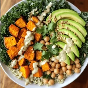- 1 cup quinoa, rinsed - 2 cups vegetable broth - 1 cup chickpeas, rinsed and drained - 1 cup sweet potato, peeled and diced - 1 tablespoon olive oil - 1 teaspoon smoked paprika - 1 teaspoon cumin - Salt and pepper to taste - 1 cup kale, chopped - 1 avocado, sliced - 1/4 cup sunflower seeds - 1/4 cup tahini - Juice of 1 lemon - Water to thin tahini (if needed) - Fresh cilantro for garnish I love using quinoa as the base. It’s full of protein and fiber. Cooking it in vegetable broth adds extra flavor. Chickpeas give a nice texture. They also add more protein to your meal. Sweet potato adds a sweet touch. Roasting them makes them crispy and tasty. Olive oil brings richness and helps the spices stick. Smoked paprika and cumin add warmth. They create a lovely aroma as you cook. Kale adds vibrant green color and crunch. Avocado is creamy and balances the bowl. Sunflower seeds add a nice crunch. They also bring healthy fats. Tahini makes the dressing creamy. It pairs well with lemon juice for brightness. Fresh cilantro adds a pop of flavor and freshness. All these ingredients come together for a filling and nutritious meal. Check out the Full Recipe for details on how to make it! - Rinse quinoa and chickpeas in cold water. - Peel and dice sweet potatoes into small cubes. - Chop kale into bite-sized pieces and slice avocado. - Preheat your oven to 425°F (220°C) to roast sweet potatoes. - Toss diced sweet potatoes with olive oil, smoked paprika, cumin, salt, and pepper. - Spread sweet potatoes on a baking sheet and roast for 25-30 minutes. - In a medium saucepan, bring vegetable broth to a boil. - Add rinsed quinoa, reduce heat, cover, and simmer for 15 minutes. - Check if quinoa is fluffy and all liquid is absorbed. - In a large bowl, mix chickpeas, roasted sweet potatoes, and chopped kale. - Start with a layer of quinoa in your bowl. - Top with the chickpea and sweet potato mix. - Add sliced avocado and a sprinkle of sunflower seeds. - Drizzle tahini dressing over the top. - Garnish with fresh cilantro and serve. For more detailed cooking steps, check out the Full Recipe. A great vegan Buddha bowl needs a mix of protein, carbs, and veggies. This balance gives you energy and keeps you full. Quinoa acts as a strong base; it offers protein and fiber. Chickpeas add even more protein. Sweet potatoes give you healthy carbs and a sweet taste. To make your bowl fun to eat, use a variety of colors. Bright orange sweet potatoes, deep green kale, and creamy avocado make your dish pop. Mix textures too! Add crunchy sunflower seeds to contrast with soft avocado. Roasting and steaming are two great ways to cook veggies. Roasting brings out natural sweetness. It makes sweet potatoes crispy on the outside, soft on the inside. Simply toss your veggies in olive oil and spices, then roast them at 425°F for 25-30 minutes. Steaming, on the other hand, keeps veggies tender and bright. It’s great for greens like kale. Just steam them for a few minutes until they are vibrant and tender. Cooking quinoa is simple. Rinse it first to remove bitterness. Then, boil it in vegetable broth for flavor. Once boiling, reduce the heat, cover, and cook for about 15 minutes. When done, let it sit for five minutes before fluffing with a fork. Spices and dressings can elevate your bowl. Try smoked paprika and cumin for a warm, earthy taste. For a fresh kick, squeeze some lemon juice over your dish. Adding herbs like cilantro can brighten flavors too. They add a fresh twist without extra calories. You can mix tahini with lemon juice and water for a smooth dressing. Adjust the water until you reach your desired thickness. These tips will help you make a delicious and nutritious vegan Buddha bowl. For a full recipe, check out the [Full Recipe]. {{image_2}} You can switch quinoa for other grains. Brown rice or farro work well. These grains add their unique tastes. They also change the texture. Mixing grains is another fun choice. You can blend quinoa with wild rice or millet. This adds variety to your Buddha bowl. If you want different protein, try other legumes. Black beans or lentils are great options. You can also use tofu for a hearty bite. For a crunchy twist, add nuts or seeds. Almonds, walnuts, or pumpkin seeds can give you that perfect crunch. Using seasonal veggies makes your bowl fresh. In summer, add tomatoes and cucumbers. In fall, try roasted squash or Brussels sprouts. This way, your meal stays exciting and new. You can also adapt for dietary needs. If you're gluten-free, just swap out grains. Enjoy your personalized, healthy meal! For the full recipe, check out the section above. To keep your Vegan Buddha Bowl fresh, follow these tips: - Store leftovers in airtight containers. - Refrigerate within two hours of serving. - Use separate containers for each ingredient. This keeps flavors fresh. - Quinoa and roasted sweet potatoes can last up to four days. - Store kale and avocado separately to prevent browning. When it’s time to enjoy your leftovers, here’s how to reheat: - Use a microwave for quick reheating. Heat quinoa and veggies in 30-second bursts. - Stir between intervals for even heating. - For crispy sweet potatoes, use an oven or air fryer. Bake at 350°F for 10-15 minutes. - Keep components separate until serving for the best taste and texture. - Reheat tahini dressing gently in a bowl of warm water to thin it out. These tips help you enjoy your Vegan Buddha Bowl again, keeping it tasty and nutritious! For a complete recipe, check out the Full Recipe. You can use several alternatives for tahini. Here are a few ideas: - Almond butter - Cashew butter - Sunflower seed butter - Greek yogurt (not vegan) - Soy sauce for a different flavor These substitutes can work well. Each one adds its own twist to the dressing. Try them and see which you like best! A Vegan Buddha bowl can last up to four days in the fridge. To keep it fresh: - Store it in an airtight container. - Separate the dressing from the bowl. This helps maintain the crispness of the veggies and the flavor of the dressing. Yes, you can prepare a Vegan Buddha bowl in advance. Here’s how: - Cook the grains and veggies ahead of time. - Store each ingredient separately. - Assemble the bowl just before eating. This method keeps your meal fresh and tasty. You can also mix and match ingredients for variety. Enjoy your easy meal prep! A Vegan Buddha Bowl combines wholesome ingredients like quinoa, chickpeas, and roasted sweet potatoes. You prepare each element to boost flavor and nutrition. Balance protein, carbs, and veggies for the best results. Don’t shy away from experimenting with new grains or seasonal veggies, too. Storage and reheating are simple, keeping meals fresh and delicious. This bowl is more than just food; it’s a chance to customize meals to fit your taste and health needs. Enjoy the process, and share your favorite bowl creations!