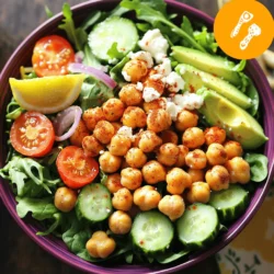 To make a tasty Crispy Chickpea Salad, you need a few key ingredients. Here’s what you’ll gather: - Canned Chickpeas - Olive Oil - Spices: Smoked Paprika & Garlic Powder - Fresh Vegetables: Mixed Greens, Cherry Tomatoes, Cucumber, Red Onion - Optional Ingredients: Avocado & Feta Cheese - Dressing Ingredients: Tahini & Lemon Juice Each ingredient plays an important role. The chickpeas give protein and crunch. Olive oil adds flavor and helps with roasting. Smoked paprika and garlic powder create a warm, savory taste. Fresh vegetables bring color and nutrition. Avocado and feta cheese are great add-ins that boost creaminess and richness. The tahini dressing with lemon juice ties everything together with a zesty kick. When you gather these ingredients, you set yourself up for a fresh and flavorful salad. This dish is not just healthy; it is also fun to make and share. Check out the Full Recipe to get all the details! - Draining and Rinsing Start by opening the can of chickpeas. Pour the chickpeas into a strainer. Rinse them under cold water. This removes excess salt and makes them cleaner. Let them drain well for a few minutes. - Seasoning and Tossing In a bowl, add the drained chickpeas. Pour in 2 tablespoons of olive oil. Then, sprinkle 1 teaspoon of smoked paprika and 1 teaspoon of garlic powder on top. Season with salt and pepper to taste. Toss everything together until the chickpeas are well coated. - Oven Temperature and Timing Preheat your oven to 400°F (200°C). Spread the seasoned chickpeas on a baking sheet. Make sure they are in a single layer. Bake them for 20-25 minutes. This will make them golden and crispy. - Tips for Crispy Texture Halfway through baking, shake the pan gently. This helps the chickpeas cook evenly. Keep an eye on them. They should be crunchy, not burnt. - Chopping Vegetables While the chickpeas bake, chop your veggies. Dice 1 cucumber and halve 1 cup of cherry tomatoes. Thinly slice 1/4 red onion. These add freshness and crunch to your salad. - Mixing the Salad Ingredients In a large bowl, combine the mixed greens, chopped cucumber, tomatoes, and red onion. Toss the veggies gently to mix them. This forms the vibrant base of your salad. - Whisking the Ingredients In a small bowl, add 2 tablespoons of tahini and 1 tablespoon of lemon juice. Whisk these together until smooth. This will be the creamy dressing for your salad. - Adjusting Consistency If the dressing is too thick, add a little water. Whisk again until you reach your desired texture. The dressing should be pourable but not too runny. - Adding Chickpeas and Optional Ingredients Once the chickpeas are crispy, let them cool for a few minutes. Add them to the salad bowl. You can also add 1/2 sliced avocado and 1/4 cup of crumbled feta cheese if you want. - Tossing and Serving Drizzle the tahini dressing over the salad. Toss everything together gently. Serve immediately and enjoy the fresh flavors of your crispy chickpea salad! You can find the Full Recipe for more details. To get the best crispy chickpeas, you must dry them well. - Oven Techniques: Preheat your oven to 400°F (200°C). Drain and rinse the canned chickpeas. Pat them dry with a kitchen towel. Toss them with olive oil and spices. Spread them in a single layer on a baking sheet. Bake for 20-25 minutes. Shake the pan halfway for even cooking. They should be golden and crunchy. - Alternative Methods (e.g., Air Fryer): You can also use an air fryer. Preheat it to 375°F (190°C). Place the seasoned chickpeas in the basket. Cook for about 15-20 minutes. Shake the basket halfway to ensure even crisping. To make your chickpeas pop, add more spices. - Additional Spices to Consider: Try cumin for warmth, or chili powder for heat. You can also use onion powder for a savory kick. Experiment with dried herbs like oregano or thyme. - Popular Add-ins for Extra Flavor: Add nuts or seeds for crunch. Roasted sunflower seeds or sliced almonds work well. You can also mix in fresh herbs like parsley or cilantro for a fresh taste. Present your salad in a way that is as tasty as it is pretty. - Best Pairings with Other Dishes: This salad pairs well with grilled chicken or fish. Serve it alongside a warm pita or in a wrap. It also goes great with a side of hummus for more flavor. - Presentation Ideas for Serving: Use a large bowl to show off the colorful ingredients. Layer the salad with greens at the bottom and chickpeas on top. Garnish with lemon wedges for a bright touch. You could also sprinkle some extra feta on top for a stunning finish. Don't forget to check out the Full Recipe for more details! {{image_2}} Vegan Considerations This salad is already vegan since it uses chickpeas and fresh veggies. If you skip the feta, you stay true to vegan values. You can also add more plant-based proteins like quinoa or lentils for extra nutrition. Gluten-Free Options Crispy Chickpea Salad fits gluten-free diets. All the ingredients are naturally gluten-free. Just make sure any dressings or extras you use are also gluten-free. Other Legumes or Proteins You can swap chickpeas for black beans or kidney beans. Both options add great taste and texture. For a protein boost, think about adding grilled chicken or tofu. Seasonal Vegetables Use seasonal veggies to keep the salad fresh. In summer, add bell peppers or corn. In fall, think about roasted sweet potatoes or squash. Each change brings new flavors. Alternative Dressings to Try If tahini isn’t your thing, try a balsamic vinaigrette. You can mix olive oil with lemon juice for a tangy taste. A yogurt-based dressing can also add creaminess. Flavor Profiles to Experiment With Add spices like cumin or curry powder for a new twist. Fresh herbs like basil or cilantro can brighten your salad. Mix and match until you find your favorite combo. For the complete recipe, check the [Full Recipe]. To keep your crispy chickpea salad fresh, store it in an airtight container. This helps keep the veggies crunchy and the flavors bright. Avoid mixing the chickpeas with the salad if you plan to eat it later. Instead, keep them separate until you serve. Use a glass or plastic container with a tight lid for best results. This will help maintain the salad’s taste and texture. You can freeze crispy chickpeas, but the salad does not hold up well. If you freeze the chickpeas, store them in a freezer-safe bag. When ready to eat, thaw them in the fridge and reheat them in the oven at 400°F (200°C) for about 10 minutes. This will bring back their crunch. However, I do not recommend freezing the salad itself. The fresh veggies will lose their crispness. Your salad lasts about 3 days in the fridge. Store it in the airtight container I mentioned earlier. If you see any wilting greens or soggy veggies, it's time to toss it. Look for signs like a bad smell or discoloration. These signs mean your salad is no longer fresh. Enjoy it while it’s still vibrant and tasty! To make crispy chickpeas, start with canned chickpeas. Drain and rinse them well. Pat them dry with a towel. Toss them in a bowl with olive oil, smoked paprika, garlic powder, salt, and pepper. Spread the chickpeas on a baking sheet. Bake at 400°F (200°C) for 20-25 minutes. Shake the pan halfway through for even cooking. When they turn golden and crunchy, they are done. Yes, you can use dried chickpeas. Soak them overnight in water. Cook them until soft, then drain and dry them well. The method for seasoning and baking remains the same. Just make sure they are fully cooked and dry before baking. You can add many toppings to this salad. Here are some great options: - Sliced radishes - Chopped herbs like parsley or cilantro - Toasted nuts or seeds - Grated carrots - A dollop of yogurt These toppings add flavor and texture. To make the salad more filling, consider adding protein. Grilled chicken or chickpeas work well. You can also add quinoa or farro for extra carbs. Adding more avocado or nuts can help too. These ingredients will keep you full longer. Crispy Chickpea Salad is healthy and packed with nutrients. Chickpeas provide protein and fiber. Mixed greens offer vitamins and minerals. Tomatoes add antioxidants, while avocados give healthy fats. The dressing with tahini adds more nutrients. Overall, this salad is a balanced meal, rich in flavor and good for you. For the full recipe, check out the details above. In this blog post, we covered how to make a tasty Crispy Chickpea Salad. I shared the key ingredients and step-by-step instructions for preparing the salad. I also included helpful tips for achieving crispy chickpeas and variations to suit dietary needs. Storing leftovers properly ensures the salad stays fresh longer. Remember, this salad is not just delicious; it is also versatile. You can change the flavors and ingredients based on your taste. Enjoy making and sharing this healthy dish!