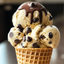 To make this tasty treat, gather these main ingredients: - 2 cups heavy cream - 1 cup whole milk - 3/4 cup granulated sugar - 2 teaspoons vanilla extract - 1/2 teaspoon salt - 1/2 cup mini chocolate chips - 1 cup cookie dough bites (homemade or store-bought) These ingredients create a rich and creamy base. The heavy cream adds the smooth texture that makes this ice cream so delightful. Whole milk balances the creaminess while sugar sweetens the mix. Vanilla extract brings warmth, and a pinch of salt enhances all the flavors. You can add your twist to this ice cream. Consider these optional ingredients: - Crushed nuts for crunch - Swirls of caramel or fudge - Different types of chocolate chips - Flavor extracts like almond or mint Using these additions, you can create a unique flavor profile. If you love nuts, add chopped walnuts or pecans. For a fun surprise, try swirls of caramel. These options let you experiment and find your perfect bite. Here’s a quick look at the nutritional breakdown for one serving of this ice cream: - Calories: 350 - Total Fat: 25g - Saturated Fat: 15g - Carbohydrates: 30g - Sugar: 20g - Protein: 4g This ice cream is a treat, so enjoy it in moderation. It has a good amount of sugar and fat, making it rich and decadent. Check the labels if you use store-bought cookie dough for extra info. You can find the full recipe in the article to guide you through making this delicious ice cream. To start, grab a large mixing bowl. Add 2 cups of heavy cream, 1 cup of whole milk, and 3/4 cup of granulated sugar. Use a whisk to mix until the sugar dissolves. Then, add 2 teaspoons of vanilla extract and 1/2 teaspoon of salt. Mix again until everything is well combined. Next, pour the mixture into your ice cream maker. Follow the manufacturer's instructions for churning. This usually takes around 20 to 25 minutes. Keep an eye on it until you see a soft-serve consistency. During the last 5 minutes of churning, add in 1/2 cup of mini chocolate chips and 1 cup of cookie dough bites. Gently fold them in to mix evenly. After churning, transfer your ice cream to a lidded container. Smooth the top with a spatula. Freeze it for at least 4 hours or until firm. When it's time to serve, let it sit out for a few minutes. This helps soften it for easier scooping. Enjoy this delightful treat! For the full recipe, check the section above! When making chocolate chip cookie dough ice cream, avoid over-churning. If you churn too long, the ice cream can become icy. Watch the time closely, especially the last few minutes. Another mistake is adding too much cookie dough at once. If you clump it together, it can freeze too hard. Instead, break it into smaller pieces. To boost flavor, use high-quality vanilla extract. This small change makes a big difference. You can also try different chocolate chips. Experiment with dark, milk, or even white chocolate. For added texture, include chopped nuts or sprinkles. This gives each bite a fun crunch. Serve your ice cream in waffle cones or clear bowls. This adds a touch of flair. Top it with extra cookie dough bites and a drizzle of chocolate sauce. Make sure to scoop the ice cream when it’s slightly softened. This helps you get perfect, round scoops. Enjoy your delicious treat! For the full recipe, check out the detailed instructions. {{image_2}} You can make this ice cream dairy-free and vegan easily. Swap heavy cream and milk with coconut cream and almond milk. Use maple syrup instead of granulated sugar for sweetness. Look for vegan cookie dough bites or make your own with plant-based butter. This way, you still enjoy the treat without dairy. Get creative with flavors! Add peanut butter or mint extract for a twist. You can also mix in crushed cookies or nuts for crunch. Try different chocolate chips, like dark or white chocolate. Each change adds a new layer of fun to your ice cream. Ice cream sandwiches are a great way to enjoy your treat. Use two cookies and fill them with your chocolate chip cookie dough ice cream. You can make your own cookies or buy them. For a fun twist, roll the edges in sprinkles or mini chocolate chips. This makes a perfect summer snack! For the complete recipe, check out the Full Recipe section. To keep your chocolate chip cookie dough ice cream fresh, store it in an airtight container. This prevents freezer burn and keeps the ice cream creamy. Make sure to press a piece of plastic wrap against the surface before sealing. This helps keep air out and moisture in. Your ice cream can stay good in the freezer for about two weeks. However, for the best flavor and texture, try to eat it within a week. When you’re ready to enjoy, let the container sit at room temperature for a few minutes. This softens the ice cream, making it easier to scoop. Look for ice crystals on the surface. These mean the ice cream may have freezer burn. If it smells off or has a strange color, it’s best to toss it. Always trust your senses. If something seems wrong, it’s safer to not eat it. Yes, you can use store-bought cookie dough. It saves time and effort. Just make sure you choose high-quality dough. You want the flavor to shine through in your ice cream. I like using mini cookie dough bites. They mix well and add a nice texture. Homemade ice cream can last about two weeks in the freezer. After that, it may lose some taste and texture. To keep it fresh, store it in an airtight container. This helps prevent freezer burn and keeps it creamy. I recommend a compressor ice cream maker for best results. These machines chill the mixture fast. This helps make a smoother ice cream. If you want a more affordable option, a bowl-style maker works too. Just remember to freeze the bowl ahead of time. Yes, you can make this ice cream without a machine. Pour the mixture into a large container and freeze it. Every 30 minutes, stir it well for the first few hours. This helps break up ice crystals and keeps the ice cream creamy. Once it’s firm, scoop it out and enjoy! For the full recipe, check out the earlier section. You now know how to make chocolate chip cookie dough ice cream. We covered key ingredients, preparation steps, and tips to avoid common mistakes. You also learned ways to customize flavors and store your ice cream properly. Remember, making ice cream at home can be fun and tasty. Use this guide to enjoy a sweet treat that suits your taste. Happy making!