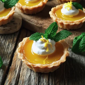 To make mini lemon tarts, gather these simple ingredients: - 1 cup all-purpose flour - 1/4 cup powdered sugar - 1/2 cup unsalted butter, softened - 1/4 teaspoon salt - 1 large egg yolk - 1/4 cup granulated sugar - 2 large eggs - 1/2 cup fresh lemon juice (about 3 lemons) - 1 tablespoon lemon zest - 1/4 teaspoon baking powder - Fresh mint leaves (for garnish) - Whipped cream (optional, for serving) You can swap some ingredients if needed. For the all-purpose flour, use a gluten-free blend. Instead of unsalted butter, you can use coconut oil. If you want a lower sugar option, try a sugar substitute in the filling. For a richer flavor, you can use brown sugar instead of granulated sugar. Always adjust the amount to taste. Garnishing your mini lemon tarts makes them pop! Fresh mint leaves add a nice touch, both in flavor and look. You can also top them with whipped cream for added creaminess. Try adding some crushed berries or a sprinkle of powdered sugar for a sweet finish. These little touches make your tarts even more inviting. For the full recipe, check out the complete instructions above. To start, preheat your oven to 350°F (175°C). Next, grab a mini muffin tin and grease it with cooking spray or butter. In a bowl, mix together 1 cup of all-purpose flour, 1/4 cup of powdered sugar, and 1/4 teaspoon of salt. Then, add in 1/2 cup of softened unsalted butter. Mix until the blend looks like coarse crumbs. Stir in 1 large egg yolk until the dough holds together. If it's too crumbly, add a teaspoon of cold water. Now, press the dough into the bottom and sides of each cavity in the mini muffin tin. Make sure to prick the bottoms with a fork. This helps keep the shells from puffing up. Bake the tart shells for 12-15 minutes until they turn lightly golden. Once done, let them cool in the tin for about 10 minutes before moving them to a wire rack. In a separate mixing bowl, whisk together 1/4 cup of granulated sugar, 2 large eggs, 1/2 cup of fresh lemon juice (that’s about 3 lemons), 1 tablespoon of lemon zest, and 1/4 teaspoon of baking powder. Mix until all the ingredients blend well. The filling should be smooth and bright. Pour the lemon filling into each tart shell, filling them about three-quarters full. Be careful not to overfill, as the filling may spill while baking. Now, return the tarts to the oven and bake for another 15-20 minutes. You’ll know they are done when the filling feels set and slightly firm to the touch. After baking, remove the tarts and let them cool completely. When ready to serve, garnish with fresh mint leaves and a dollop of whipped cream if you like. These mini lemon tarts are a delight and easy to make! For the full recipe, check out the details above. To avoid soggy bottoms in your mini lemon tarts, you should pre-bake the crust. This step helps set the dough before adding the filling. Pricking the bottoms with a fork also helps. It allows steam to escape. Bake the shells until they are lightly golden for the best results. For a filling that sets well, use fresh lemon juice and eggs. These two ingredients create a nice balance of tartness and richness. Make sure to whisk the mixture until smooth to prevent lumps. Pour the filling gently into the shells, filling them three-quarters full. This gives the filling room to rise slightly while baking. After baking, let the tarts cool in the tin for about 10 minutes. This helps them hold their shape. Then, transfer them to a wire rack to cool completely. Serve them chilled or at room temperature. Garnish with fresh mint leaves and whipped cream for a tasty touch. You can find the Full Recipe for more detailed instructions. {{image_2}} You can switch up the flavor of your mini tarts. Use lime or orange instead of lemon. Lime gives a tangy twist, while orange adds a sweet zest. To make lime tarts, use fresh lime juice and zest in the filling. For orange tarts, do the same with orange juice and zest. The method stays the same, and you will have new flavors to enjoy! If you need a gluten-free option, it's easy to adapt. Use gluten-free flour instead of all-purpose flour. There are many good brands available. The taste will be just as good, and your guests won't even notice! Follow the same steps in the recipe. You can still have a delicious dessert that everyone can enjoy. For an extra special treat, add a meringue topping. Make meringue with egg whites and sugar. Whip the egg whites until stiff peaks form. Spread the meringue on top of your cooled tarts. Then, use a kitchen torch to lightly brown the meringue. This adds a nice look and a sweet finish. Your mini lemon tarts will taste amazing with this added layer! For the full recipe, check out the details above. To keep your mini lemon tarts fresh, place them in an airtight container. Make sure they are completely cool before sealing. This helps keep the crust crisp and the filling smooth. You can store them in the fridge for up to three days. If you want to enjoy them later, freezing is a great option. You can freeze mini lemon tarts for longer storage. First, let them cool completely. Then, wrap each tart in plastic wrap. Place the wrapped tarts in a freezer-safe container or bag. They can last up to three months in the freezer. When you're ready to eat them, thaw them in the fridge overnight before serving. Mini lemon tarts stay fresh for about three days in the fridge. If you freeze them, they can last for three months. To reheat, place them in a preheated oven at 350°F (175°C) for about 10 minutes. This warms the filling and helps restore some crispness to the crust. Enjoy your tarts warm for the best taste! For the full recipe, check out [Full Recipe]. Yes, you can make these tarts ahead of time. I recommend baking the tart shells and filling them the day before. Store the baked shells in an airtight container. Keep the filling in the fridge. When you are ready to serve, just pour the filling into the shells. Bake them again to warm up the filling. Serve these mini lemon tarts chilled or at room temperature. A little whipped cream on top adds a nice touch. Fresh mint leaves make a great garnish too. You can also serve them with a slice of lemon for a pop of color. You can find pre-made mini lemon tarts at many grocery stores. Look in the dessert section or the bakery. Some bakeries also sell them fresh. Check online for local shops that might carry them. If you want a quick treat, this is an easy option! For the complete recipe, check out the Full Recipe section. You learned about the ingredients, tips, and steps to make mini lemon tarts. We explored variations for different tastes and how to store them. Remember, making these tarts is fun and rewarding. Use fresh ingredients for the best flavor. Try the meringue topping for a special touch. I hope you feel ready to bake! Enjoy sharing your tasty mini lemon tarts with friends and family.