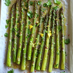 - 1 pound fresh asparagus, trimmed - 3 tablespoons olive oil - 3 cloves garlic, minced - Zest of 1 lemon - Juice of 1 lemon - 1 teaspoon sea salt - ½ teaspoon black pepper - ½ teaspoon red pepper flakes (optional for heat) - Fresh parsley, chopped (for garnish) Fresh asparagus gives this dish its crisp texture. Use bright green stalks for the best flavor. Olive oil adds richness and helps the asparagus roast evenly. Garlic brings a savory punch that pairs well with lemon. The lemon zest and juice brighten the dish, making it zesty and fresh. Sea salt enhances all the flavors, while black pepper adds a mild kick. Red pepper flakes can give a touch of heat, but you can skip them if you prefer milder food. Finally, fresh parsley adds a pop of color and freshness when you garnish the dish. When picking asparagus, look for firm and bright green stalks. The tips should be tightly closed. Avoid any yellow or wilted stalks, as they may taste bitter. You can check for freshness by bending a stalk gently. If it snaps easily, it is fresh. If it bends, it is likely old. Always choose asparagus that feels heavy for its size to ensure it is juicy and tender. To make lemon garlic roasted asparagus, start with simple prep. Gather your ingredients: - 1 pound fresh asparagus, trimmed - 3 tablespoons olive oil - 3 cloves garlic, minced - Zest of 1 lemon - Juice of 1 lemon - 1 teaspoon sea salt - ½ teaspoon black pepper - ½ teaspoon red pepper flakes (optional) - Fresh parsley, chopped (for garnish) Having everything ready makes cooking easier. Preheat your oven to 400°F (200°C) so it’s hot when you’re ready to roast. 1. In a mixing bowl, blend olive oil, minced garlic, lemon zest, and lemon juice. 2. Add sea salt, black pepper, and red pepper flakes. Mix well to create a tasty marinade. 3. Lay the trimmed asparagus on a baking sheet lined with parchment paper. 4. Pour the marinade over the asparagus. Make sure every stalk gets coated. 5. Spread the asparagus in a single layer on the sheet. This helps them roast evenly. 6. Roast in the oven for 15-20 minutes. Check their doneness by piercing a stalk with a fork. It should slide in easily. 7. Once roasted, take them out and sprinkle with fresh parsley for a nice finish. 8. Serve warm for a bright and zesty side dish. To get that perfect roasted texture, choose fresh asparagus. Look for bright green color and firm stalks. Trim off the woody ends before cooking. Make sure to coat the asparagus well in the marinade. This adds flavor and helps with browning. Spacing the stalks on the baking sheet is key. They should not touch. This way, each piece gets that lovely crispness. Keep an eye on the time. Roasting for too long can make them mushy. You want tender asparagus with a slight crunch. Enjoy the burst of lemon flavor combined with garlic! To boost the taste of your lemon garlic roasted asparagus, consider these tips: - Fresh Ingredients: Always use fresh asparagus. Look for bright green stalks with firm tips. - Marinating Time: Let the asparagus sit in the marinade for 15-30 minutes. This allows the flavors to soak in well. - Extra Lemon: For a tangy kick, add more lemon zest. It brightens the dish. - Cheese Addition: Sprinkle some Parmesan cheese before serving. It adds a nice salty depth. Avoid these errors to ensure your dish shines: - Overcrowding the Pan: Give asparagus space on the baking sheet. This helps them roast evenly. - Not Trimming Stalks: Always trim the tough ends. This keeps your bites tender. - Ignoring the Oven Temp: Ensure your oven is preheated. A hot oven gives you crispy edges. - Overcooking: Check for doneness at 15 minutes. You want them tender but not mushy. Having the right tools makes cooking easier: - Baking Sheet: Use a rimmed baking sheet. It prevents spills while roasting. - Parchment Paper: Line your baking sheet with parchment. This helps with easy cleanup. - Mixing Bowl: A medium-sized bowl works best for mixing the marinade. - Tongs: Use tongs to toss the asparagus. They help coat each stalk evenly. {{image_2}} You can swap out asparagus for other veggies. Try broccoli, green beans, or zucchini. These vegetables work well with the same marinade. If you want a different flavor, use sesame oil instead of olive oil. Feel free to mix in spices you love. Add Italian herbs like oregano or basil for a twist. For a kick, try cayenne pepper instead of red pepper flakes. You can also sprinkle parmesan cheese on top before serving for extra flavor. Lemon garlic roasted asparagus shines as a side dish. Serve it alongside grilled chicken or fish. Toss it in a salad for added crunch. You can also use it in a pasta dish. Just mix it in with your favorite noodles and sauce for a tasty meal. To keep your roasted asparagus fresh, let it cool first. Use an airtight container. Store it in the fridge for up to three days. If you want to enjoy it later, make sure it’s stored properly. To reheat your asparagus, set your oven to 350°F (175°C). Place the asparagus on a baking sheet. Heat for about 10 minutes, or until warm. This keeps it crispy and tasty. You can also use a microwave. Heat it in short bursts, checking often. This way, it won't get soggy. If you want to freeze your asparagus, do this before cooking. Trim and wash the stalks, then blanch them in boiling water for two minutes. Next, cool them in ice water. Pat them dry and place them in a freezer bag. They can last up to three months in the freezer. When you're ready to use them, just roast straight from the freezer. Yes, you can use frozen asparagus if fresh is not available. However, fresh asparagus gives the best texture. Frozen asparagus may lose some crunch. If you use frozen, adjust your cooking time. Roast it for about 10-15 minutes instead of the usual 15-20. Check for doneness by piercing a stalk with a fork. Asparagus is done when it is tender and slightly crispy. You can test it by piercing a stalk with a fork. It should slide in easily. The color should be bright green, and the tips may start to brown slightly. Keep an eye on it during the last few minutes to avoid overcooking. Lemon garlic roasted asparagus pairs well with many dishes. It complements grilled chicken or fish nicely. You can also serve it with roasted potatoes for a hearty meal. For a lighter option, try it with a fresh salad. The lemon flavor brightens up any dish! This blog post covered everything you need for lemon garlic roasted asparagus. You learned about key ingredients, preparation steps, and tips to avoid mistakes. I shared ways to enhance flavor and creative serving ideas, plus storage tips for leftovers. By following these steps and suggestions, you can make a delicious dish. Enjoy experimenting with variations and pairing it with your favorite meals. Roasted asparagus can be a star on any plate!