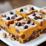 To make these yummy bars, you need some key ingredients: - 1 cup canned pumpkin puree - 1 cup brown sugar - 1/2 cup granulated sugar - 1/2 cup vegetable oil - 2 large eggs - 1 teaspoon vanilla extract - 1 1/2 cups all-purpose flour - 1 teaspoon baking soda - 1 teaspoon ground cinnamon - 1/2 teaspoon ground nutmeg - 1/2 teaspoon salt - 1 cup semi-sweet chocolate chips These ingredients create a moist and sweet base for the bars. The pumpkin adds a rich flavor, while the chocolate chips give a nice touch of sweetness. You can also add some optional ingredients to boost the taste: - 1/2 cup chopped walnuts Adding walnuts gives a nice crunch and nutty flavor. If you're not a fan of nuts, you can skip them without losing any taste. If you don’t have some ingredients, here are some swaps: - Use applesauce instead of vegetable oil for less fat. - Replace eggs with flaxseed meal mixed with water. Use 1 tablespoon of flaxseed meal and 2.5 tablespoons of water for each egg. - Swap all-purpose flour with a gluten-free blend if needed. These substitutions help keep the bars delicious, no matter your needs! First, gather all your ingredients. You will need pumpkin puree, sugars, oil, eggs, and vanilla. In a large bowl, mix the pumpkin, brown sugar, granulated sugar, and oil. Whisk these together until smooth. Next, add the eggs one by one. Mix well after each egg. Then, stir in the vanilla extract for flavor. In another bowl, mix the flour, baking soda, cinnamon, nutmeg, and salt. This blend adds spice and lifts the bars. Gradually, add this dry mix to your wet ingredients. Stir gently until just combined; avoid overmixing. Finally, fold in the chocolate chips, and walnuts if you want. Preheat your oven to 350°F (175°C). Grease your 9x13-inch baking dish, or line it with parchment paper. This helps with easy removal later. Pour the batter into the dish and spread it evenly. Bake for 25 to 30 minutes. Check for doneness by inserting a toothpick in the center. It should come out clean or with a few moist crumbs. Once baked, let the bars cool in the pan for about 10 minutes. Then, transfer them to a wire rack to cool completely. This helps them set well. When ready to serve, cut the bars into squares. For a special touch, dust them with powdered sugar. You can also add whipped cream or ice cream for a treat! To make the best pumpkin chocolate chip bars, follow these steps: - Preheat your oven to 350°F (175°C). This ensures even baking. - Grease your baking dish or use parchment paper. This helps with easy removal. - Mix wet and dry ingredients carefully. Overmixing can make the bars tough. - Use room temperature eggs. This helps create a smooth batter. You can boost the flavor and texture with a few tricks: - Add spices. Try more cinnamon or a pinch of cloves for warmth. - Use high-quality chocolate chips. This can elevate the taste. - Chop the walnuts finely. This gives a nice crunch without being overwhelming. - Mix in some orange zest. It brightens the flavor and pairs well with pumpkin. Knowing when your bars are done is key: - Check with a toothpick. Insert it into the center; it should come out clean or with a few moist crumbs. - Look for a golden-brown top. The edges should pull away slightly from the pan. - The center should be firm. It should not jiggle when you shake the pan. These tips will help you bake perfect pumpkin chocolate chip bars every time! {{image_2}} You can make these bars gluten-free. Use a 1:1 gluten-free flour mix instead of all-purpose flour. This mix works well and gives great texture. It helps keep your bars soft and chewy. Just follow the same steps in the recipe. To make these bars dairy-free, swap the semi-sweet chocolate chips for dairy-free ones. You can find great options in stores now. Also, use a plant-based oil, like coconut oil, instead of vegetable oil. This way, you can enjoy the same tasty bars without dairy. Feel free to be creative with mix-ins. Here are some ideas: - Add 1/2 cup of chopped pecans for extra crunch. - Try 1/2 cup of dried cranberries for a sweet-tart twist. - Use white chocolate chips for a fun color contrast. - Sprinkle in some pumpkin seeds for a nutty flavor. You can also enhance the spice by adding a pinch of allspice or ginger. These small changes can take your bars to a new level! Store leftover pumpkin chocolate chip bars in an airtight container. Make sure to let them cool first. They stay fresh for about 3 to 5 days at room temperature. If you want them to last longer, refrigerate them. Cold bars taste great and can last up to a week in the fridge. To freeze, cut the bars into squares. Wrap each square in plastic wrap, then place them in a freezer bag. This keeps them fresh. They can be frozen for up to three months. When you’re ready to enjoy, just take them out and let them thaw at room temperature. To reheat, use the microwave for about 10 to 15 seconds. This warms them gently. You can also use the oven. Preheat it to 350°F (175°C) and heat the bars for about 5 to 10 minutes. This keeps them soft and tasty. Enjoy your warm treat! Pumpkin chocolate chip bars last about 4 to 5 days when stored correctly. Keep them in an airtight container at room temperature. If you want them to last longer, consider refrigerating them. In the fridge, they can last up to a week. Just remember, they taste best when fresh! Yes, you can use fresh pumpkin. Start by roasting the pumpkin until it is soft. Then, scoop out the flesh and mash it well. This gives you a nice puree to use. Just make sure to measure out 1 cup of fresh pumpkin puree for the best results in your recipe. You can use several options to replace eggs. Some popular substitutes include: - 1/4 cup unsweetened applesauce - 1/4 cup mashed banana - 1 tablespoon ground flaxseed mixed with 2.5 tablespoons water (let it sit for 5 minutes) These substitutes work well and keep the bars moist and tasty. In this post, we explored the key ingredients for pumpkin chocolate chip bars, from essential to optional. We detailed step-by-step instructions, including mixing, baking, and cooling. We also covered tips for perfect bars and shared variations like gluten-free and dairy-free options. Storage tips ensure your leftovers stay fresh. Remember, the right ingredients and techniques make all the difference. Enjoy your baking adventure!