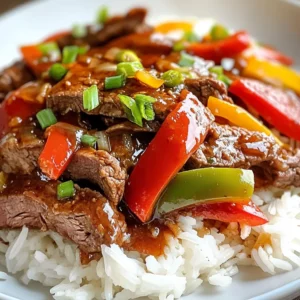 - 1.5 lbs flank steak, sliced into thin strips - 2 bell peppers (red and green), sliced - 1 large onion, sliced - 3 cloves garlic, minced - 1 cup beef broth - 1 tablespoon soy sauce - 1 tablespoon oyster sauce - 1 tablespoon Worcestershire sauce (optional) - 1 tablespoon cornstarch mixed with 2 tablespoons water (for thickening) - 2 tablespoons olive oil - Salt and pepper to taste - Cooked rice or noodles for serving Gathering the right ingredients is key to making great crockpot pepper steak. Start with flank steak, as it cooks well in a slow cooker. Slice it thinly for better texture. Fresh bell peppers, both red and green, add color and crunch. A large onion and minced garlic enhance the dish's flavor. For the sauce, beef broth is a must. It keeps the meat juicy and tender. Soy sauce offers a savory touch, while oyster sauce deepens the taste. A dash of Worcestershire sauce adds a rich layer, but it’s optional. Lastly, cornstarch thickens the sauce at the end. Olive oil helps in searing the steak, giving it a nice crust. Don’t forget salt and pepper to taste. Serve the pepper steak over fluffy rice or noodles for a hearty meal. {{ingredient_image_1}} First, slice the flank steak into thin strips. This cuts down cooking time and makes it tender. Next, heat olive oil in a large skillet over medium-high heat. Season the steak strips with salt and pepper. Sear the steak in batches for about 2-3 minutes on each side until browned. Once done, transfer the steak to your crockpot. In the same skillet, add sliced bell peppers, onion, and minced garlic. Sauté them for 2-3 minutes until they soften a bit. This step boosts their flavor. After sautéing, add the vegetables to the crockpot with the seared steak. Now, it’s time to mix the sauces. In a bowl, combine beef broth, soy sauce, oyster sauce, and Worcestershire sauce, if you like. Pour this mixture over the steak and veggies in the crockpot. Make sure everything is coated well. Cover the crockpot and set it to low heat. Let it cook for 6-8 hours, or on high heat for 3-4 hours. About 30 minutes before serving, stir in the cornstarch mixed with water. This thickens the sauce nicely. Adjust the cooking time as needed to ensure the sauce reaches your desired thickness. Taste it and adjust seasoning if necessary before serving. Searing the steak adds deep flavor. It helps lock in juices. Use a hot skillet to get a nice brown crust. This step makes your dish rich and tasty. Always cook the steak in batches. If you crowd the pan, it won't brown well. Each piece needs space to cook evenly. Before serving, taste your dish. This lets you know if it needs more salt or pepper. You can also add more soy sauce for a stronger flavor. If you want it spicy, sprinkle some red pepper flakes. Feel free to customize to your taste. Each cook can make this dish their own. Pepper steak pairs well with rice or noodles. They soak up the sauce nicely. For a pretty plate, garnish with sliced green onions or sesame seeds. This adds color and crunch. You can also serve it with a side of steamed veggies. They balance the meal and add freshness. Pro Tips Choose the Right Cut: Flank steak is ideal for slow cooking as it becomes tender and flavorful. However, you can also use skirt steak or sirloin if you prefer. Don't Skip the Searing: Searing the steak before adding it to the crockpot enhances the flavor through caramelization, giving your dish a rich depth. Customize Your Veggies: Feel free to add other vegetables like mushrooms or broccoli. Just make sure to cut them into uniform sizes for even cooking. Adjust the Seasoning: Always taste your dish before serving. You can add more soy sauce or a pinch of sugar to balance the flavors if needed. {{image_2}} You can switch the flank steak for boneless chicken breast. Just slice it thin. Chicken cooks well in the crockpot and absorbs the flavors nicely. Tofu is a great choice for a vegetarian option. Use firm tofu and cube it before adding it to the pot. This gives a nice texture and flavor. Feel free to get creative with vegetables. Adding mushrooms or broccoli can make the dish more colorful and nutritious. You can also use different bell pepper colors, like yellow or orange. This not only adds flavor but also makes the dish visually appealing. If you want a healthier version, try low-sodium alternatives for sauces. This keeps the taste without too much salt. You can also make this dish without oyster sauce. Just add a bit more soy sauce for flavor. This allows you to enjoy pepper steak while meeting your dietary needs. To keep your leftover pepper steak fresh, cool it first. Place it in the fridge within two hours. Use airtight containers to store it. This helps prevent spoilage. I recommend using glass or BPA-free plastic containers. They keep the flavors well and are easy to clean. When reheating, always make sure the food is hot. The best method is using the microwave. Heat in short intervals to avoid overcooking. Stir the dish between intervals for even heating. If you're using the stove, warm it on low heat. This keeps the meat tender. Ensure the internal temperature reaches 165°F for safety. You can freeze pepper steak for up to three months. Use freezer-safe containers or bags. Make sure to remove as much air as possible. To thaw, place it in the fridge overnight. If you're in a hurry, use the microwave on defrost setting. Avoid refreezing once it has thawed. This keeps the texture and taste just right. Yes, you can cook this on high heat! If you choose high heat, adjust the time to 3-4 hours. This will still give you tender steak and tasty veggies. Just remember, low heat is best for rich flavor. So, if you have the time, go for low! If you don't have flank steak, don't worry! You can use sirloin or skirt steak. Both options work well and stay juicy. For a different twist, try using boneless chicken breast or even tofu for a vegetarian meal. Pepper steak stays good in the fridge for 3-4 days. Store it in an airtight container to keep it fresh. If you want to keep it longer, consider freezing it. Just be sure to thaw it safely before enjoying it again! To make pepper steak, gather flank steak, bell peppers, and onion. Use flavor-packed sauces like soy and Worcestershire. Follow the steps for perfect cooking. Remember to sear the steak well for flavor and adjust spices to your taste. You can even switch proteins or veggies for a twist. Ultimately, this dish is versatile and easy to store. Enjoy your delicious meal!